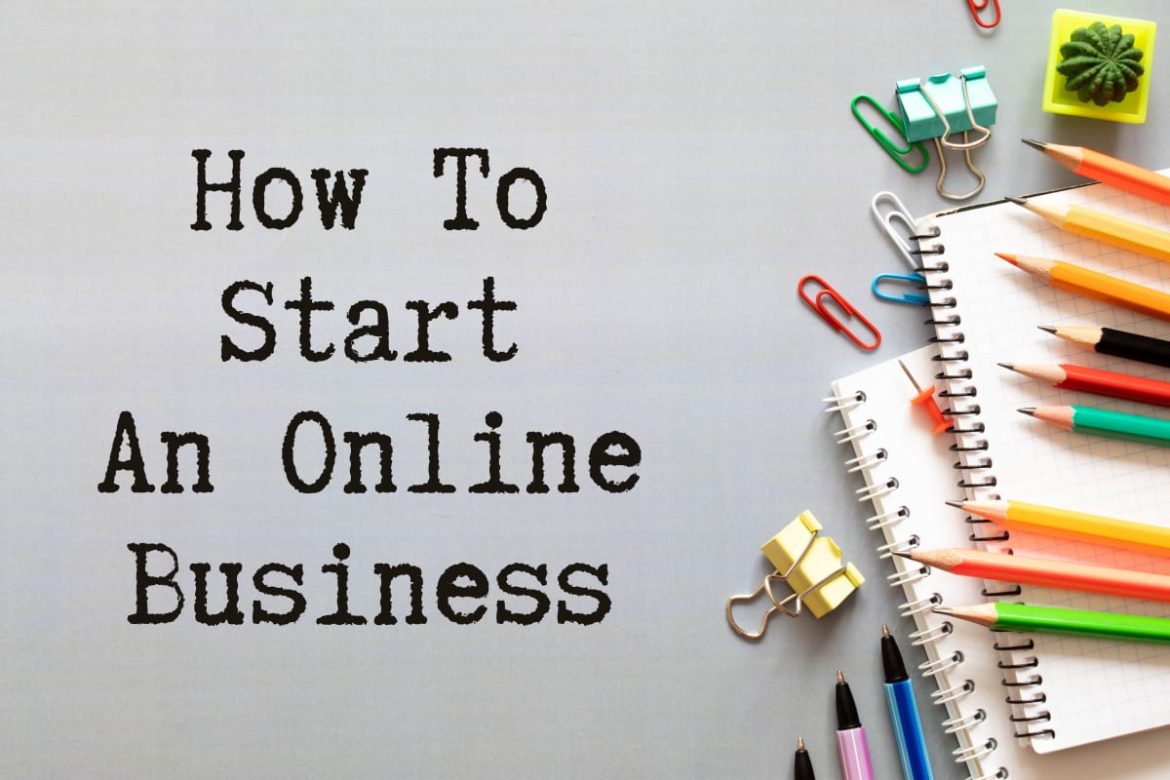 Image written How to Start an Online Business. Has pencils, spiral-bind books and paper clips